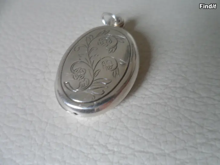 Myydään Kalevala medaljonki Lapista Hopea